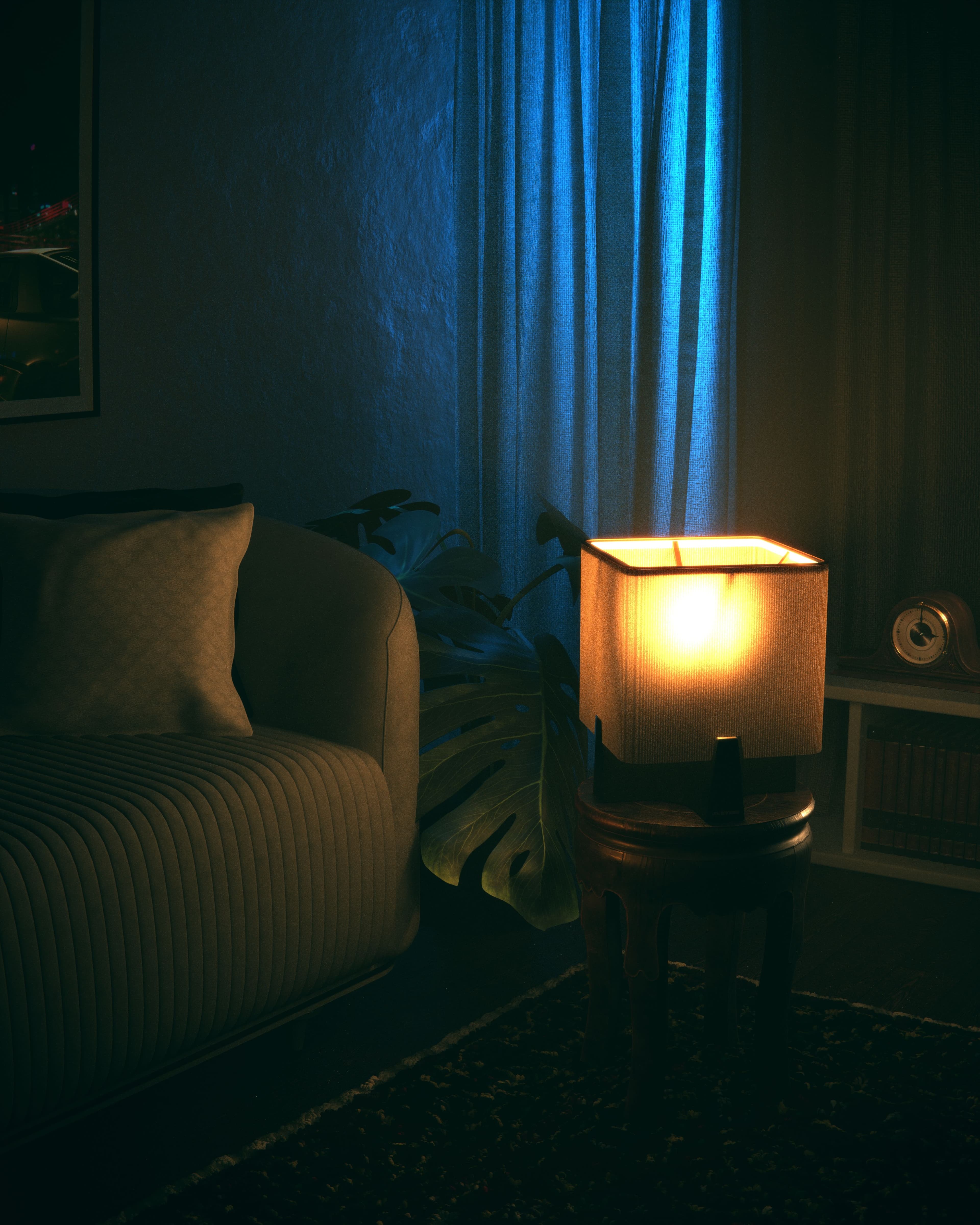 Original licensed low-light living room photograph with sofa, lamp and blue curtains