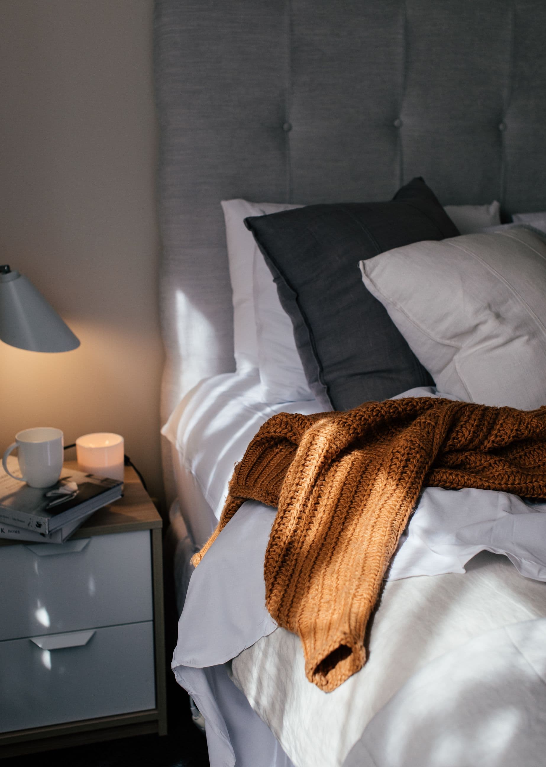 Bedroom and bedside lamp stock photograph illustrating a room shot list